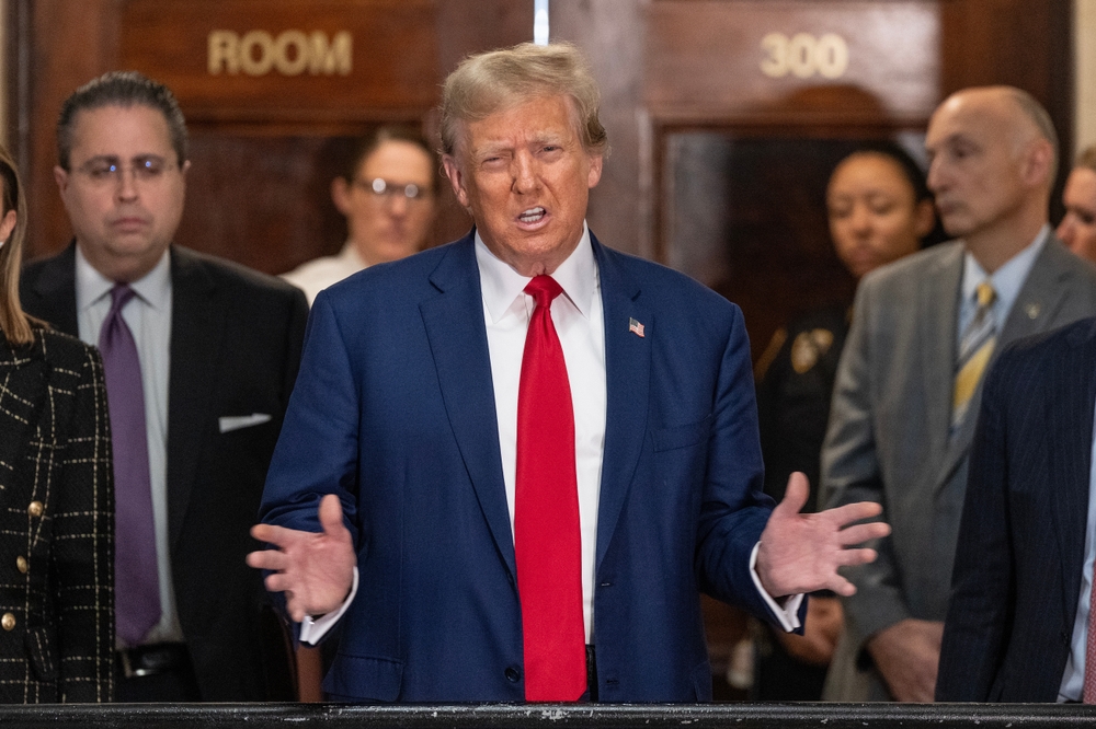 Former President Donald Trump speaks to the press before closing arguments at his civil fraud trial at State Supreme Court in New York on January 11, 2024