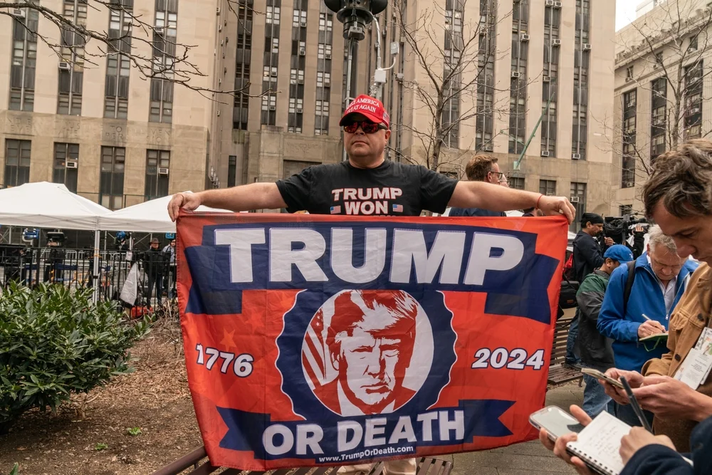 MAGA guy holds up a banner saying "Trump or Death in 2024." Introduction to this site, Donald-trump-antichrist.com