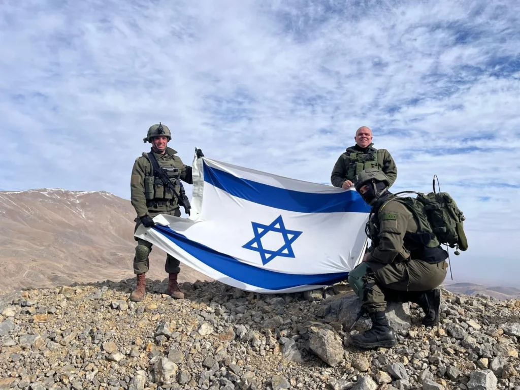 Three IDF soldiers purportedly unfurl an Israeli flag on Mt.Hermon, Syria. We Need To Talk About Greater Israel - Pt. I.
