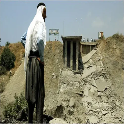 A Lebanese Bedouin man surveys what's left of a bridge obliterated by an IDF bomb.