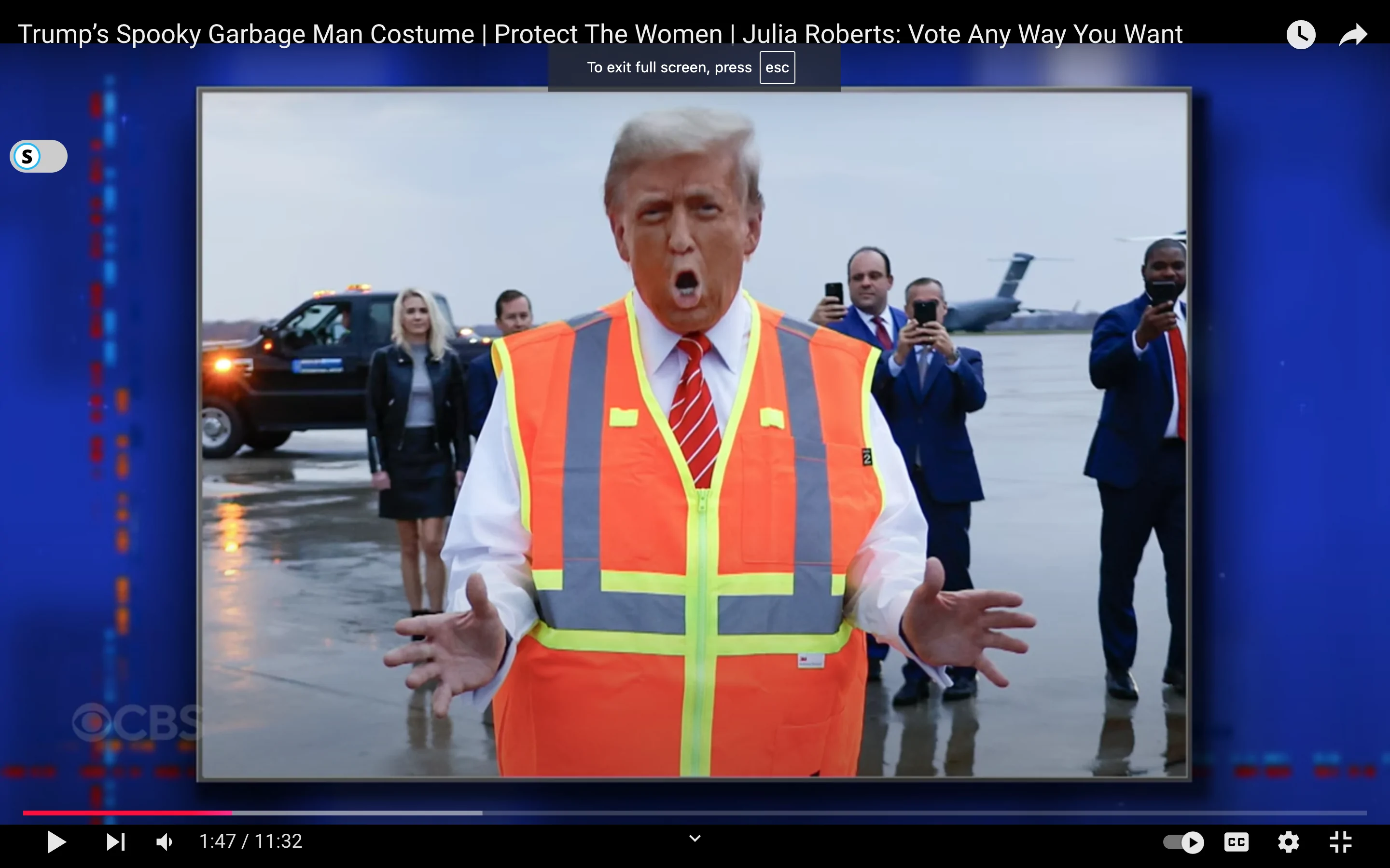 Donald Trump dressed up as a "sanitation worker" with an orange vest.